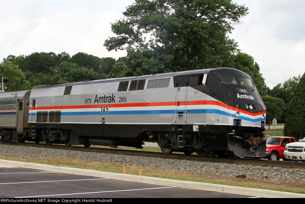 AMTK 145 leads train 80 away from the station